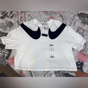 Nike woman’s cropped shirt (with tags ) size xs